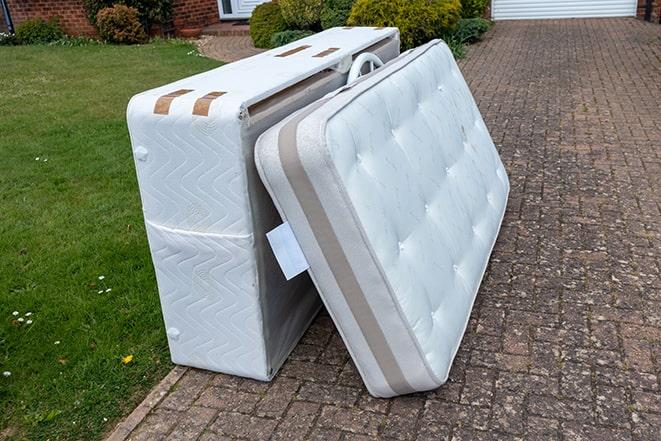 mattress being hauled away by a junk removal service